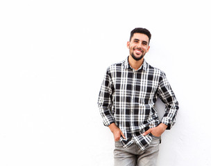 Fototapeta premium happy young north african man smiling against white background