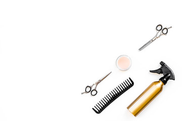 Professional tools for haircut. Sciccors, comb, spray on white background top view copy space