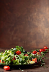 Vegetable salad with tomatoes and black olives .