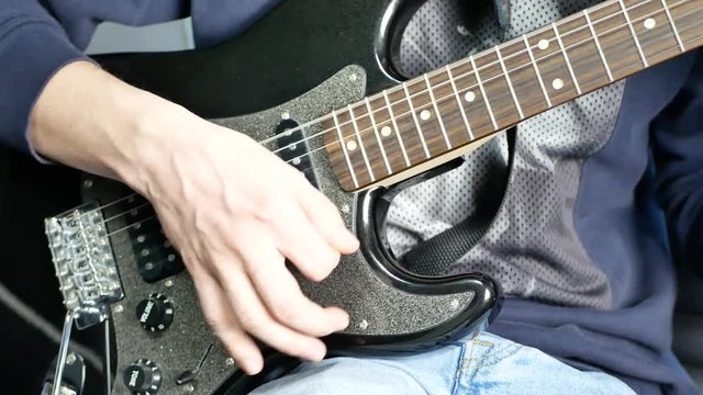 Man lead guitarist playing electrical guitar. Jazz guitarist solo practicing with guitar. Rock band practice