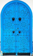 Traditional blue arched door from Sidi Bou Said in Tunisia