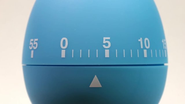 Kitchen egg timer countdown to zero time lapse.