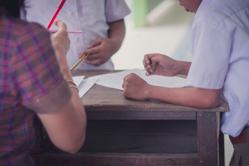 Thai Reading Examination between teacher and student grade 4 .Outside the classroom  in primary school.