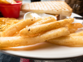 French fries on white plate with toast