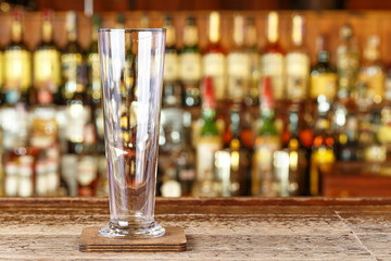 Cocktail glass on a blurry bar background