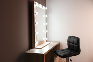 Workplace of professional makeup artist with large mirror