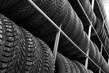 Rack with variety of car tires in automobile store