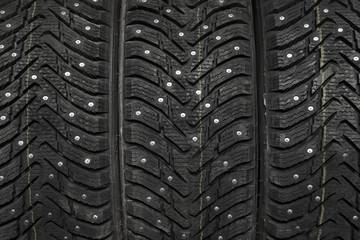 Closeup view of car tires with metal studs