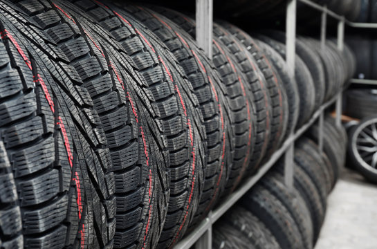 Rack with variety of car tires in automobile store