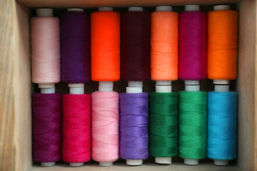 Set of color sewing threads in wooden box