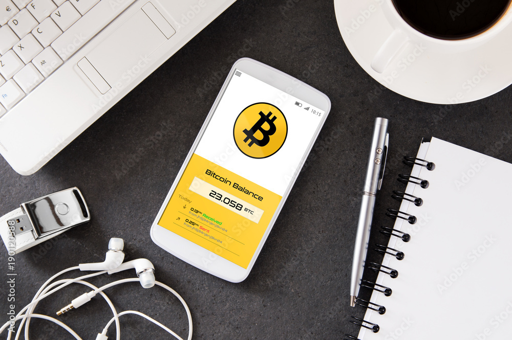 Poster smartphone is laying on the desk with cryptocurrency wallet application. interface created in graphi