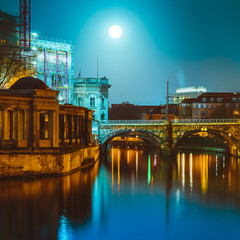 spree river at night in berlin with bode museum on the side