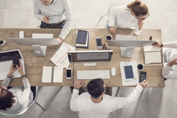 Business table and workers in meeting
