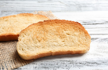 Toasted bread on wooden background