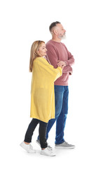 Fototapeta premium Mature couple in casual clothes walking on white background