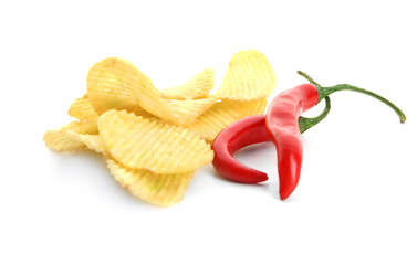 Potato chips and chili peppers on white background
