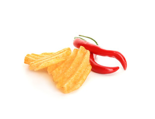 Potato chips and chili peppers on white background