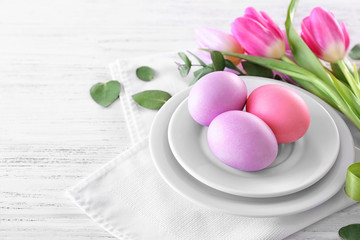 Beautiful festive Easter table setting with eggs