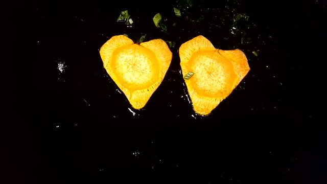 Fry carrots in the shape of heart in a frying pan