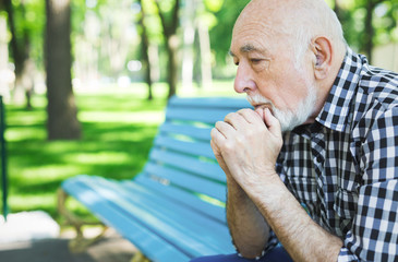 Fototapeta premium Pensive senior man outdoors