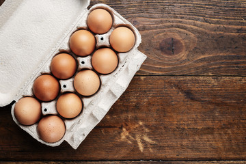 chicken eggs on a wooden background