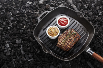 cooked steak on grill pan
