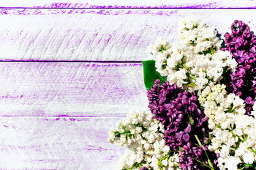 lilac flowers on wooden table. copy space.