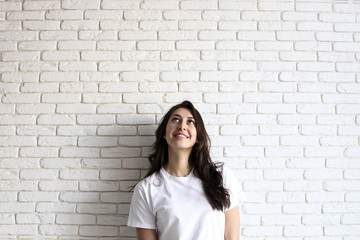 Happy millennial girl having fun indoors. Portrait of young woman with diastema gap between teeth....