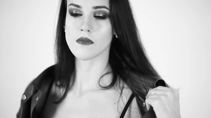 Girl in leather jacket sitting on a Chair/black and white - Powered by Adobe