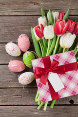 Easter eggs and colorful tulips
