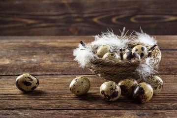 Quail eggs on a wooden table.