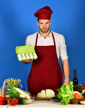 Cuisine and professional cooking concept. Man in cook uniform