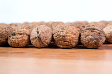 A lot of scattered walnuts close-up. A useful product.