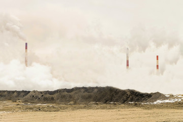Excessive pollution of the environment. Dense factory strong smog with smoking chimneys of heavy...