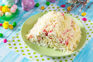 Easter recipe, festive appetizer. Salad stuffed with crab sticks - on the festive Easter table.