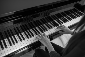 Piano music pianist hands playing. Musical instrument grand piano details with performer hand on...