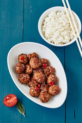 Teriyaki meatballs served with white rice. Asian style food. Top view