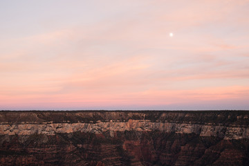 Pink sky above the Grand Canyon in Arizona after sunset. 