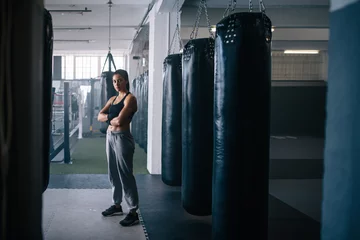 Fotobehang Female boxer at the boxing studio © Jacob Lund