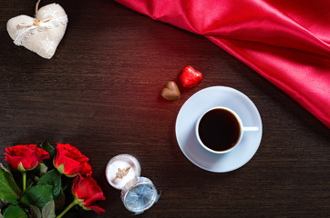 Happy Valentines Day romantic background with wedding ring, rose flowers, cup of coffee and chocolate candy