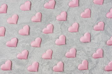 Pink silk hearts in rows