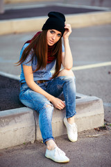 young woman in urban wear style with different emotions on parking