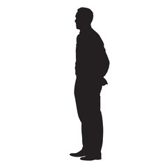 Adult man standing with his hands behind his back. Side view, vector isolated silhouette