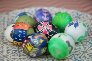 Cute hand painted bright coloured easter eggs decorated by kids