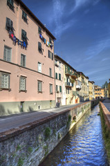 Fototapeta na wymiar Historical canal in Lucca, Italy