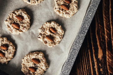 Step-by-step recipe for homemade oatmeal cookies with raisins and almonds