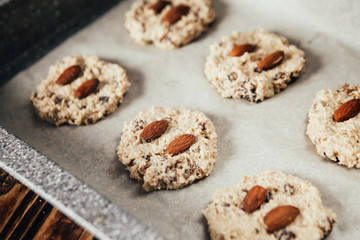 Step-by-step recipe for homemade oatmeal cookies with raisins and almonds