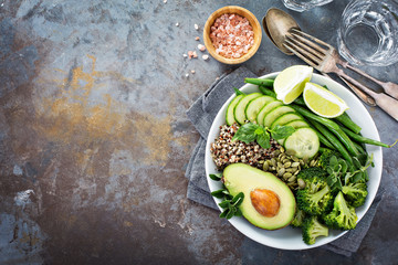 Green vegan lunch bowl with quinoa and avocado - obrazy, fototapety, plakaty