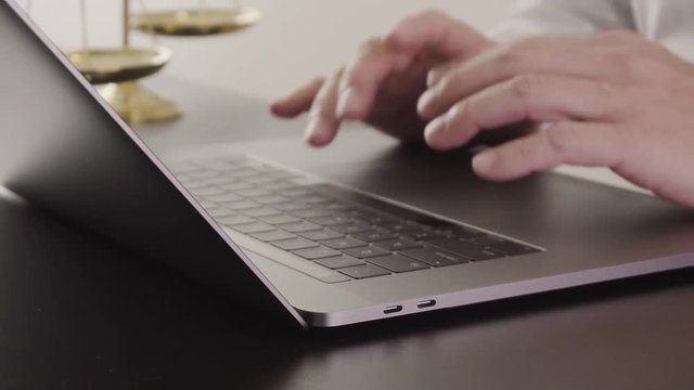 Lawyer working with new modern computer in office in slow motion