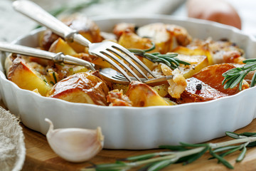 Potatoes baked with bacon and rosemary.